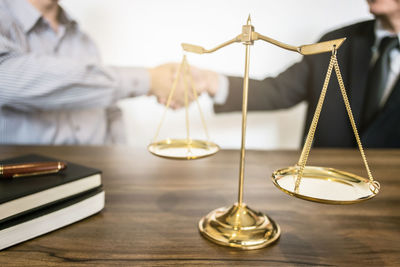 Close-up of people on table