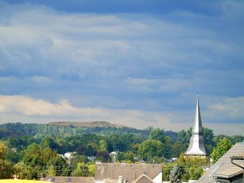 High angle view of town against cloudy sky