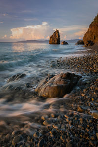 Scenic view of sea against sky at sunset