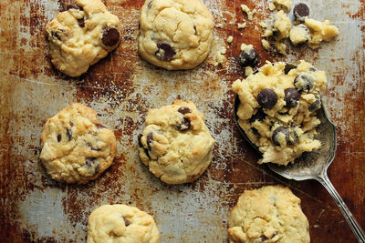 High angle view of cookies with spoon on rusty tray