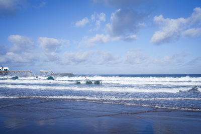 Scenic view of sea against blue sky