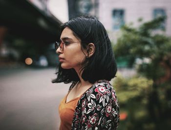 Portrait of young woman looking away