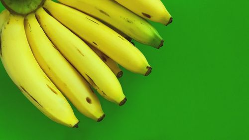 Close-up of yellow fruit over white background