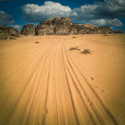 Tire tracks on the sand of the wadi rum desert. jordan