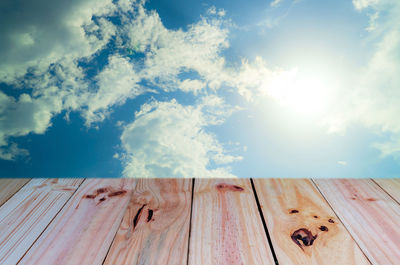 Low angle view of wooden pier over sea against sky