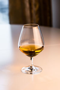 Close-up of wineglass on table