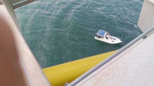 High angle view of yellow boat sailing in sea
