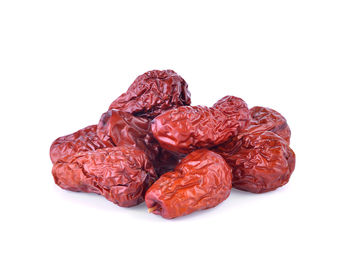Close-up of dried fruits against white background