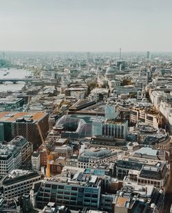 High angle view of buildings in city against clear sky