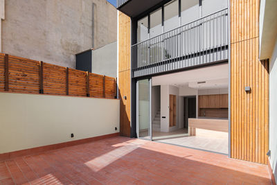 Sunny view of the patio of refurbished apartment in contemporary building in barcelona, spain