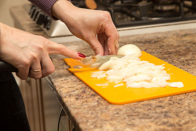 Midsection of man preparing food