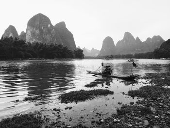 Scenic view of lake with mountains in background