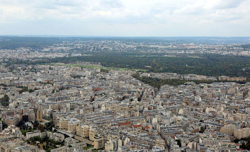 High angle view of city against cloudy sky