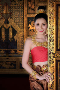 Smiling young woman in traditional clothing