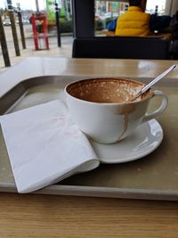 Close-up of coffee cup on table