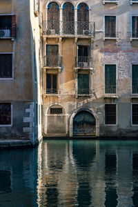 Reflection of residential building in canal