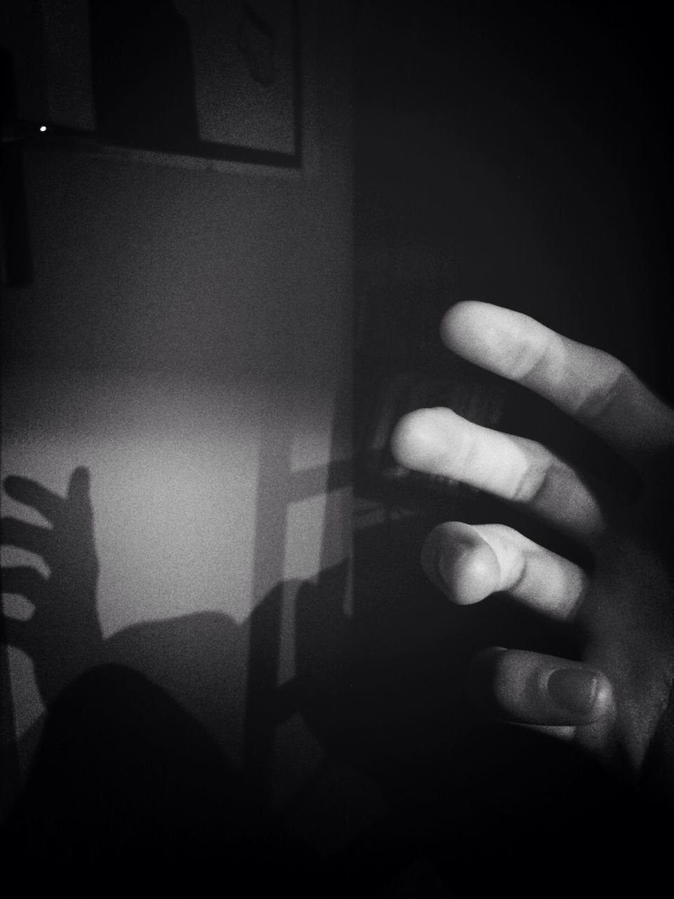 indoors, person, part of, human finger, cropped, unrecognizable person, close-up, lifestyles, home interior, dark, personal perspective, holding, wall - building feature, copy space, shadow, men