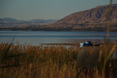 Rear view of lake against mountain range