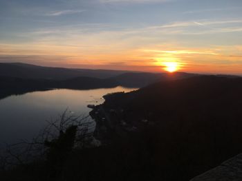 Scenic view of silhouette mountains against sky during sunset