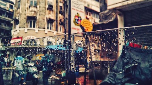 Panoramic view of wet city street during rainy season