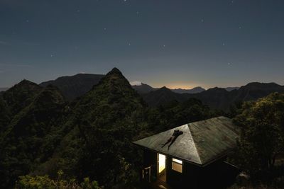 Scenic view of mountains against sky at night