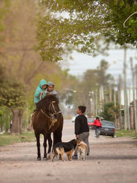 Rear view of people in humble village