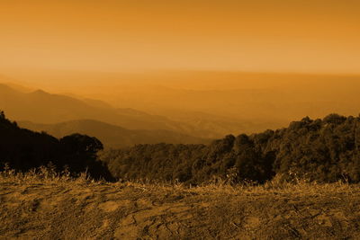 Scenic view of landscape against sky during sunset