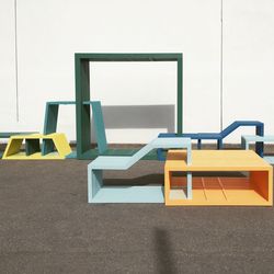 High angle view of empty chairs against wall