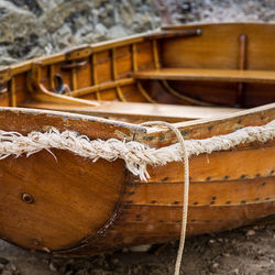 Close-up of rope tied up on wood