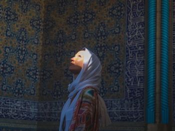 Woman in hijab looking up