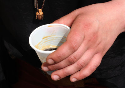 Close-up of hand holding drink