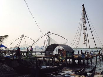 Boats moored at harbor