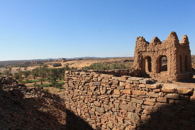 View of old ruins against blue sky