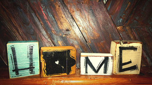 Close-up of text on wooden table