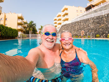 Portrait of smiling woman in swimming pool