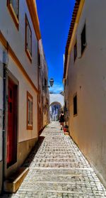 Narrow alley along buildings