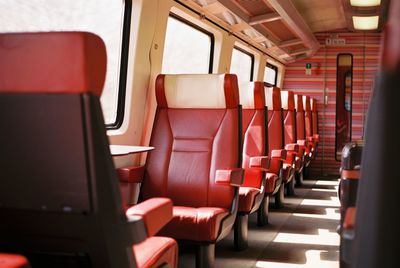 Red leather empty seats on the train