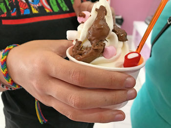 Close-up of man holding ice cream