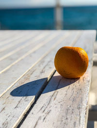 Close-up of orange fruit on wood