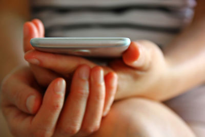 Close-up of person using mobile phone