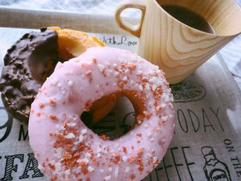 Close-up of donuts and coffee at cafe