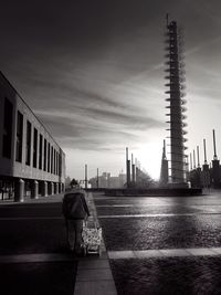 Rear view of men walking in city