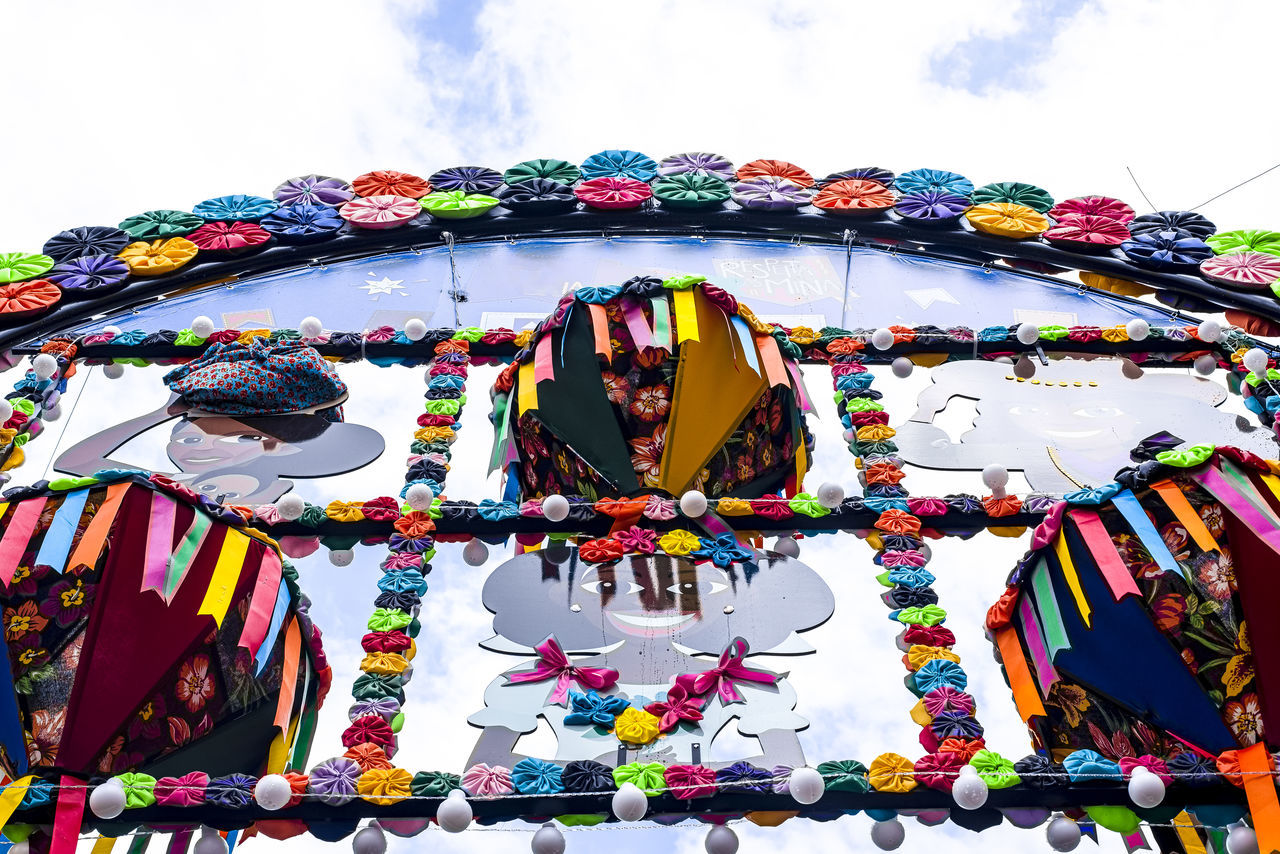 multi colored, sky, cloud, celebration, day, arts culture and entertainment, festival, nature, outdoors, decoration, low angle view, tradition, event, no people, hanging, architecture