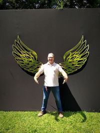 Portrait of man standing on field