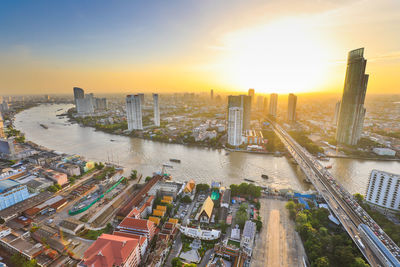 High angle view of buildings against sky during sunset