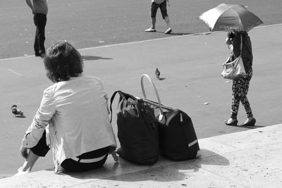 Rear view of people walking outdoors