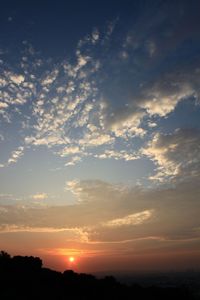 Sun shining through clouds