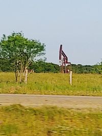 Built structure on field against sky