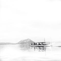 Boats moored in sea