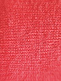 Full frame shot of red woolen fabric